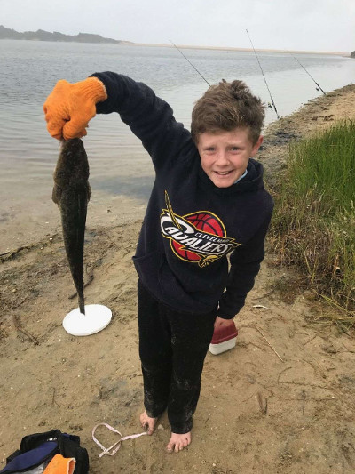 Blake with a PB 45cm on a plastic, Lake Tyers Beach