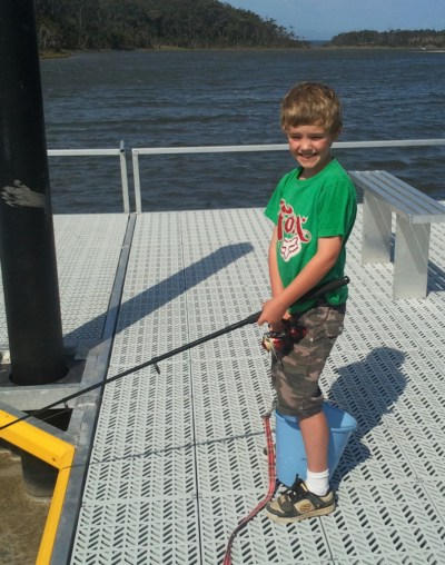 Lad on new jetty at Fishermans Landing, Lake Tyers