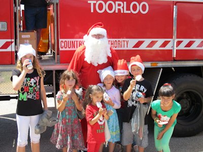 Santa with happy Children at Lake Tyers Beach