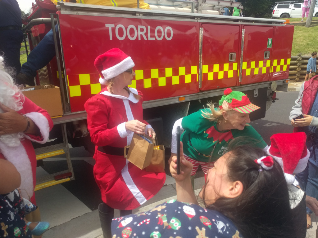 Santa at Lake Tyers Beach with a beautiful helper