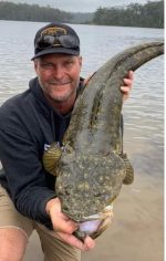 Trent Davis with a nice Flathead, Lake Tyers