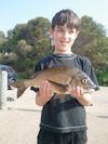 Tommy with a 37cm Bream at Lake Tyers Beach
